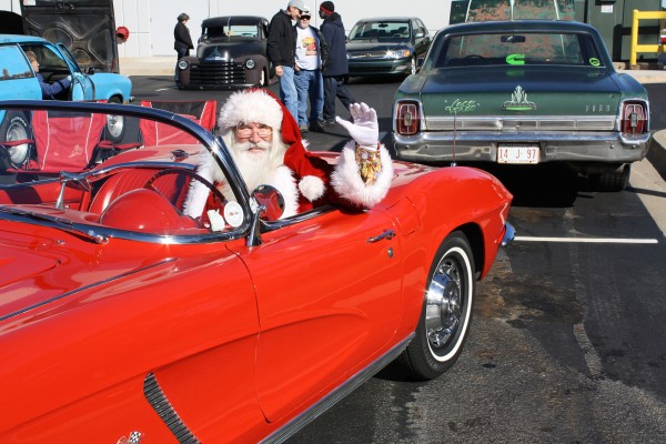 santa riding in a classic corvette