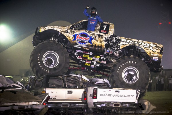 bigfoot monster truck doing a car crush at military base event