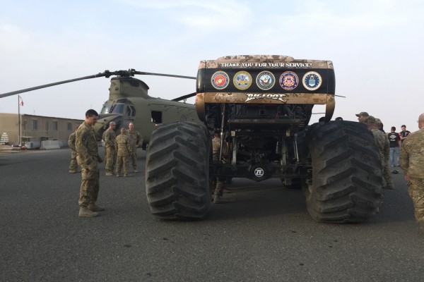 rear view of military wrapped bigfoot monster truck