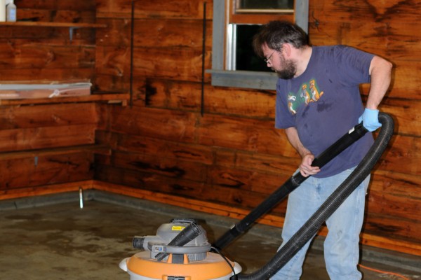 vacuuming water from a clean garage floor
