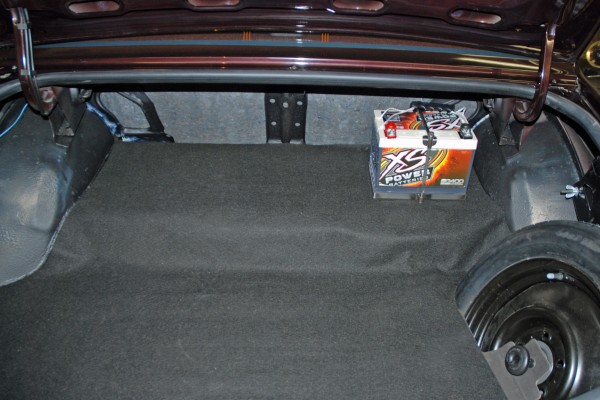battery mounted in trunk of car