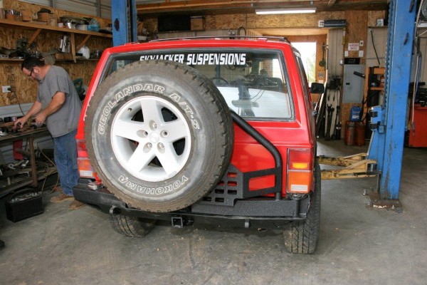 jeep cherokee xj with off road bumper and tire carrier