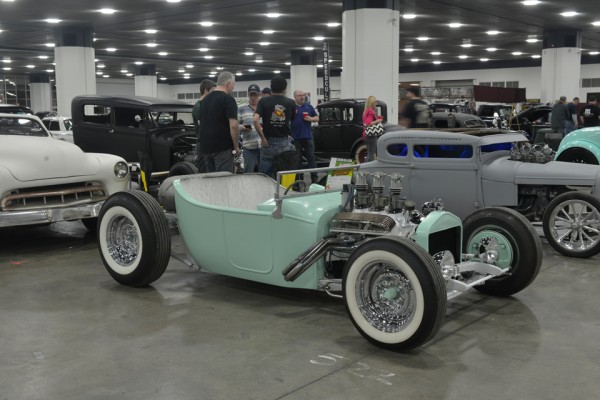 blue-green ford t-bucket hot rod with a v8 engine