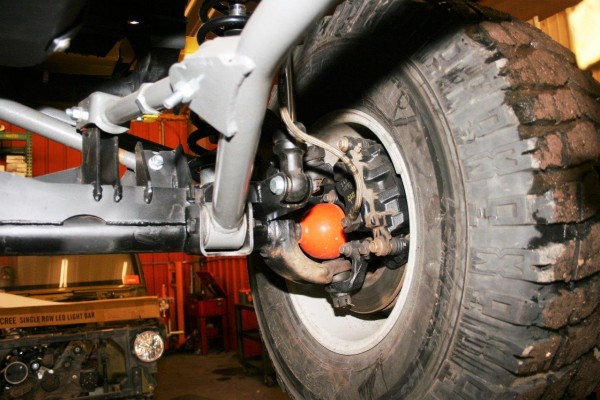 close up of inner wheel suspension parts on a jeep