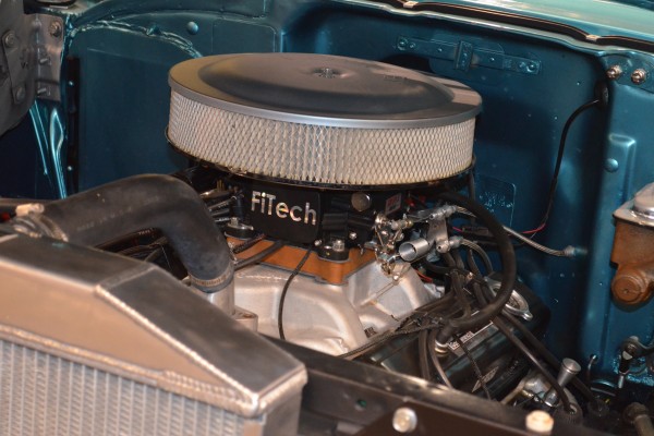 modern fitech throttle body fuel injection on a vintage v8 muscle car