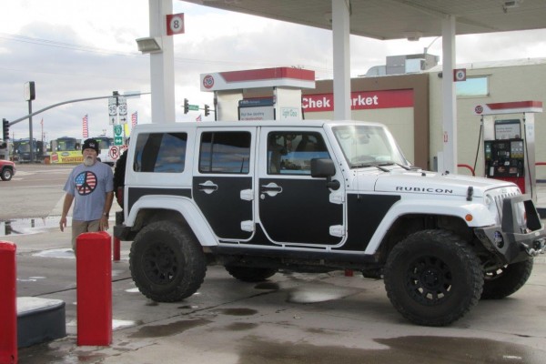 jeep wrangler rubicon with paint protection panels at a gas station