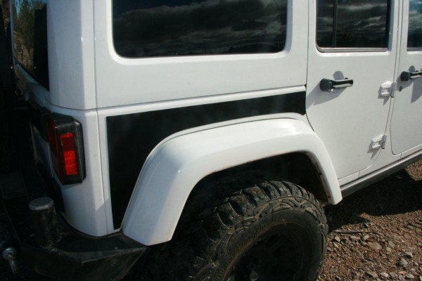 paint protection panel on the rear fender of a jeep wrangler