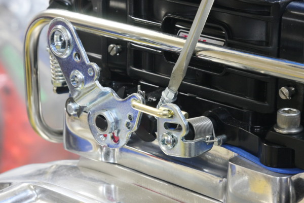 close up of throttle linkage on a carburetor