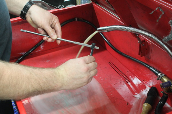 honing a linkage rod by hand