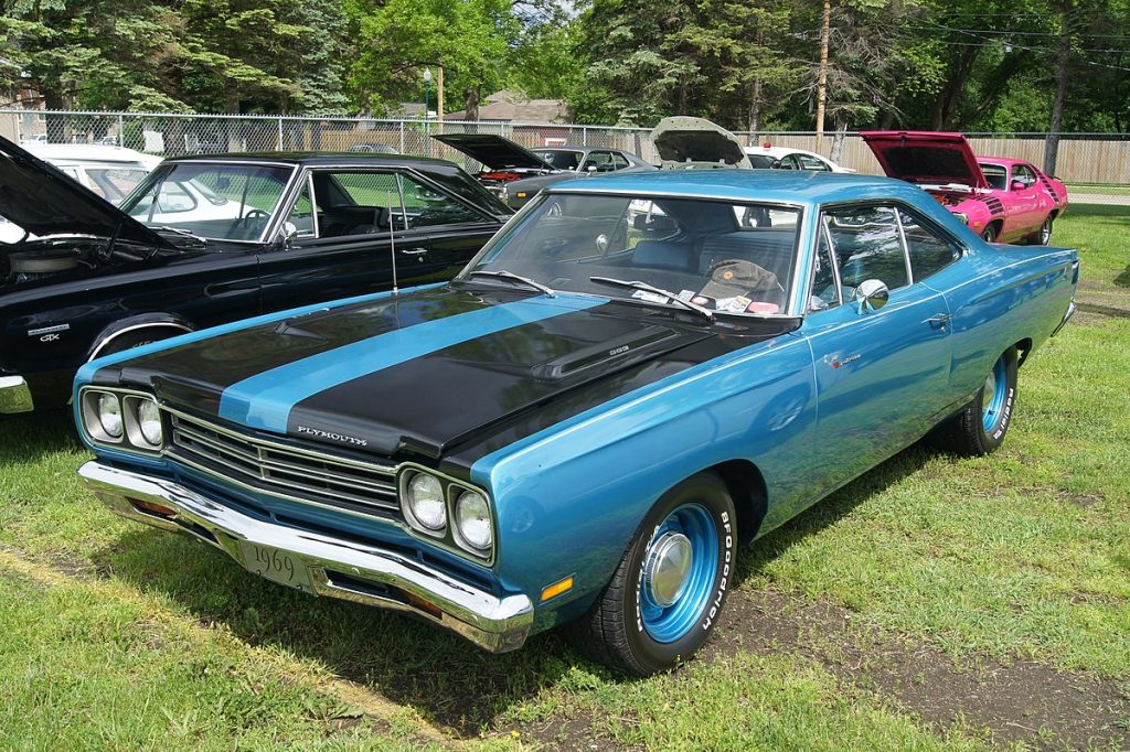 1969 plymouth road runner parked on grass at car show