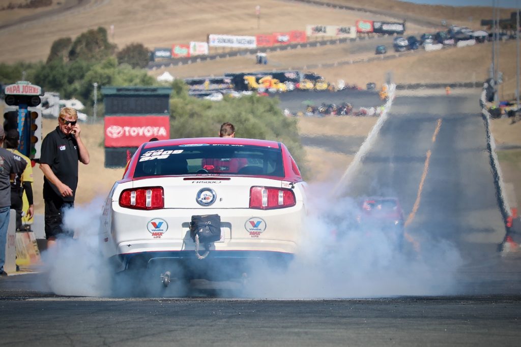 mustang dragster doing a burnout prior to a race