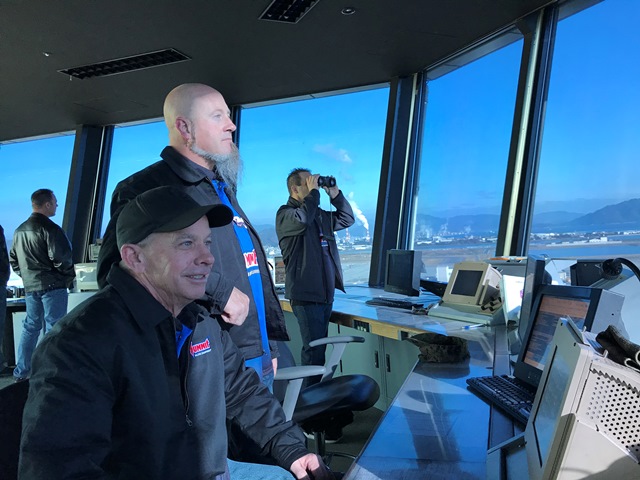 nhra drivers looking out of air control tower at military base in japan