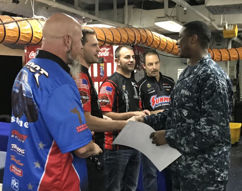 nhra and bigfoot monster truck drivers greeting u.s. military troops