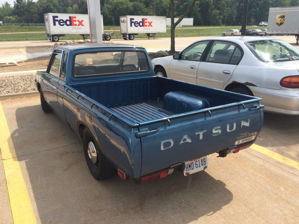 Datsun-620-pickup-truck-blue-driver-side-bed