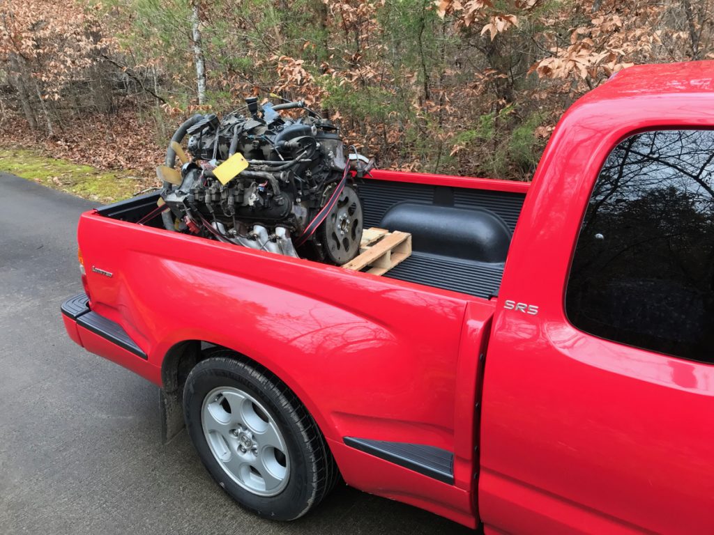 gm ls engine in the back of a toyota tacoma pickup truck