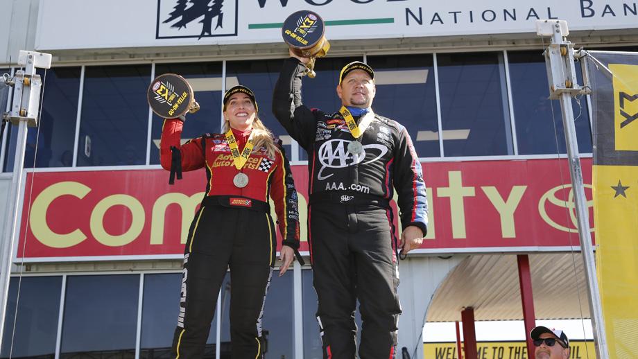 Brittany force and robert hight lifting nhra wally trophies