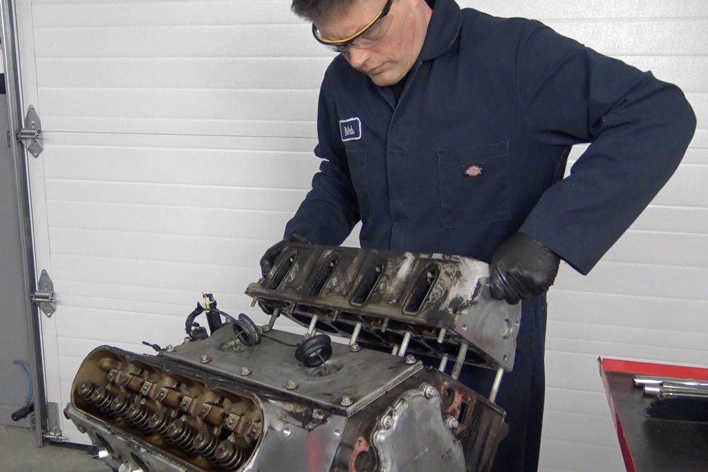 man removing cylinder heads