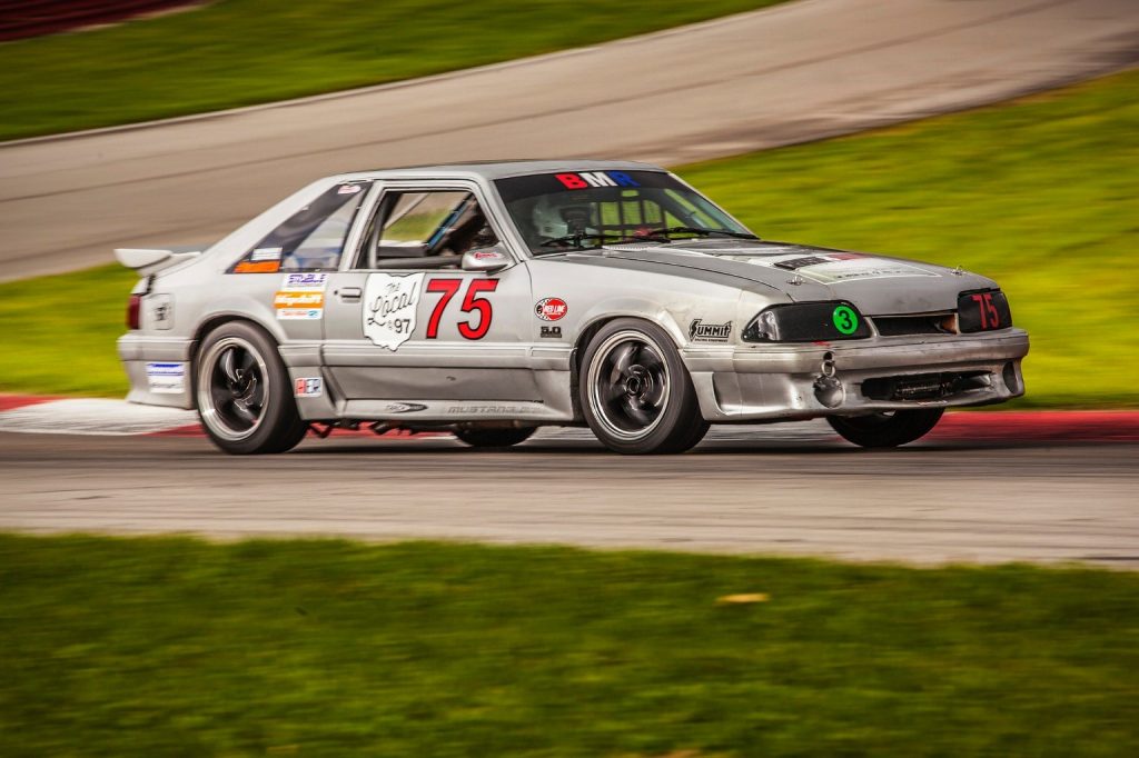 fox body mustang race car on track