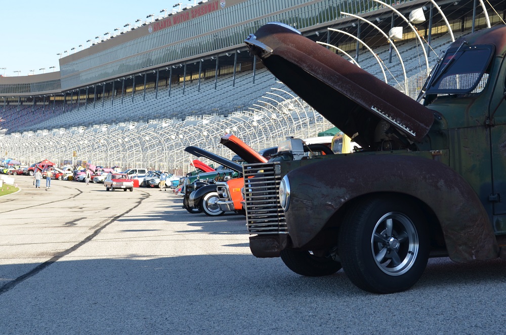 line of old cars on Atlanta motor speedway track