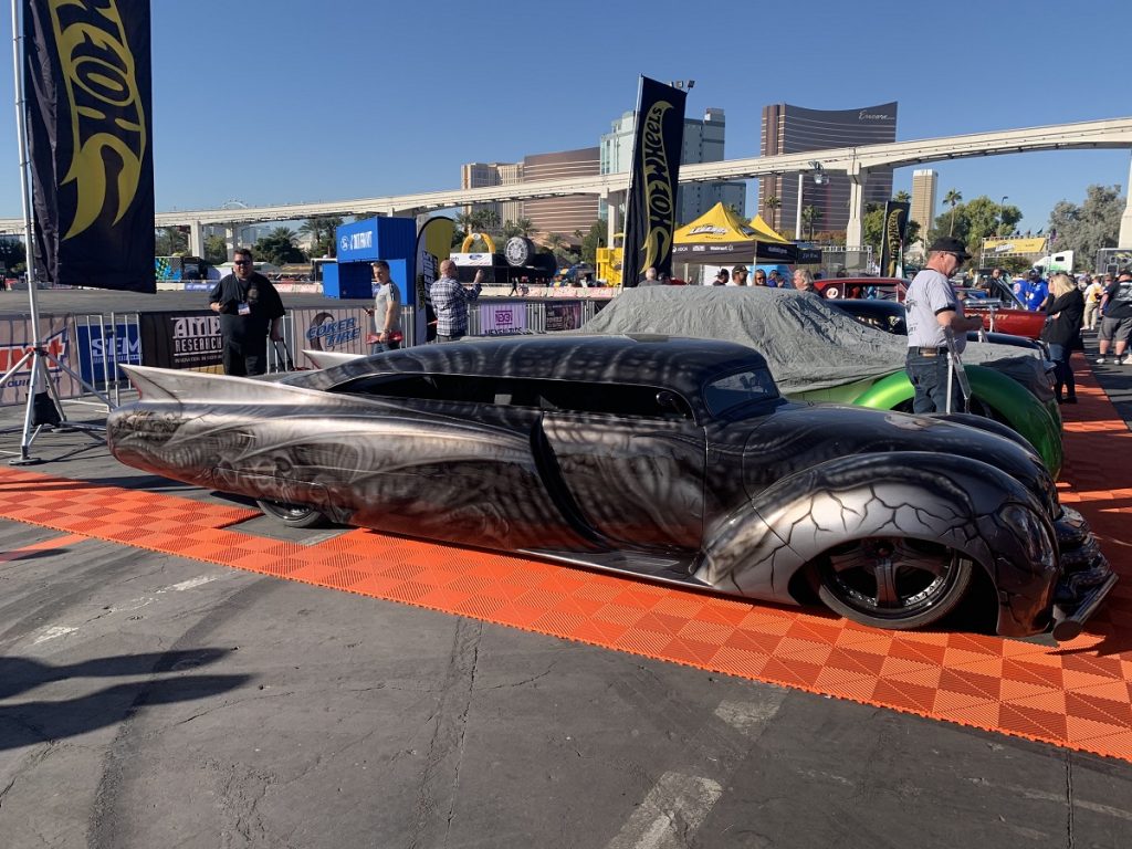lowered hot rod with Cadillac fins on display at sema 2019