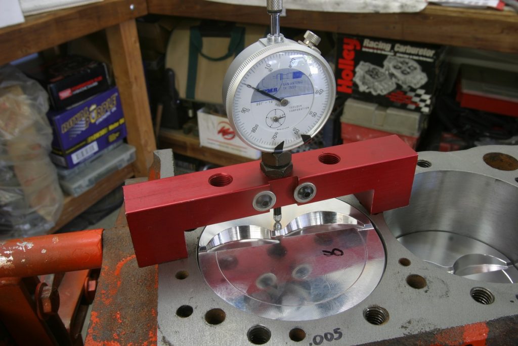checking piston travel with a dial gauge