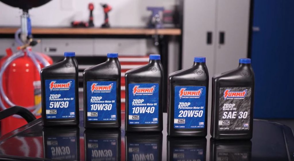 collection of summit racing brand motor oil on work table