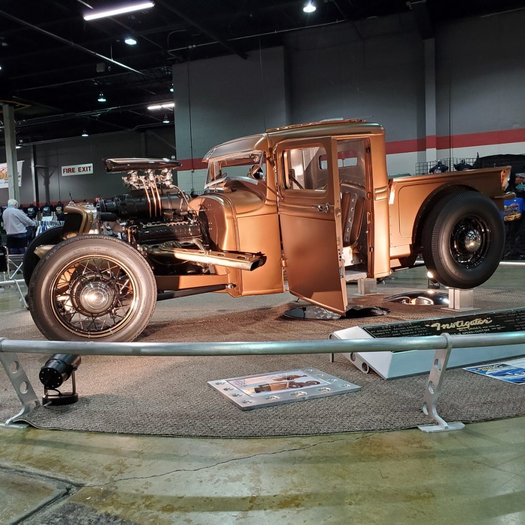 hot rod supercharged pickup truck at indoor car show