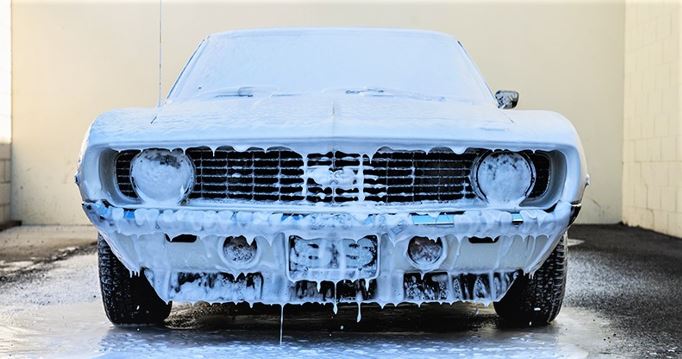 a chevy camaro ss covered in car wash soap suds