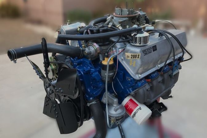 ford boss 302 engine on a stand