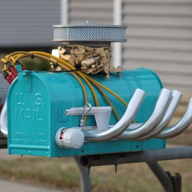 a mailbox with headers and a carburetor