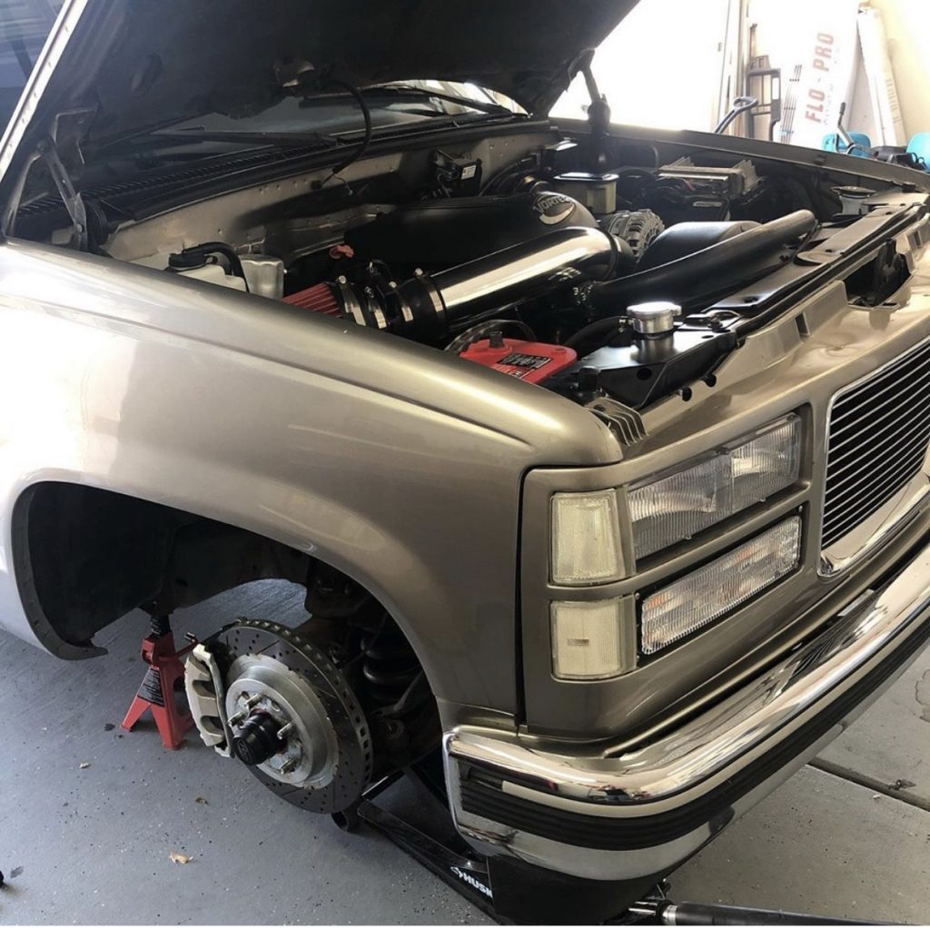 a chevy tahoe engine bay as its being worked on