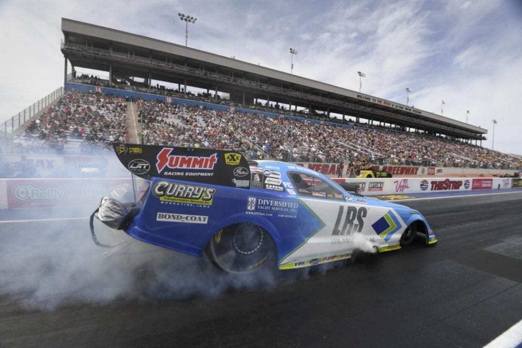 tim wilkerson does a burnout in his ford mustang nhra funny car