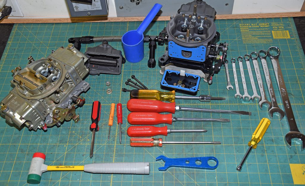 tools for tuning holley carburetors arranged on a workbench