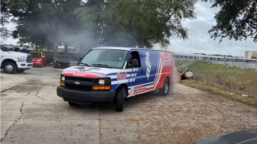 Cleetus mcfarland doing a burnout in the Summit Racing LeMullets van