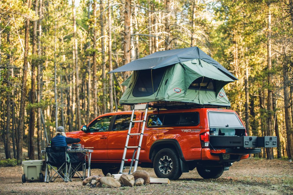 thule rooftop tent on a toyota tacoma at overlanding campsite