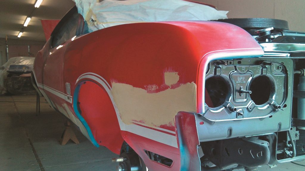 oldsmobile fender with body filler prior to sanding, paint and body work