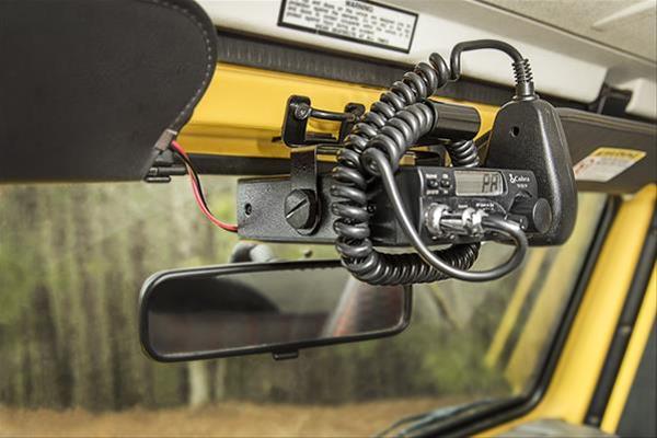 cb radio mounted high, above the mirror in a jeep tj wrangler