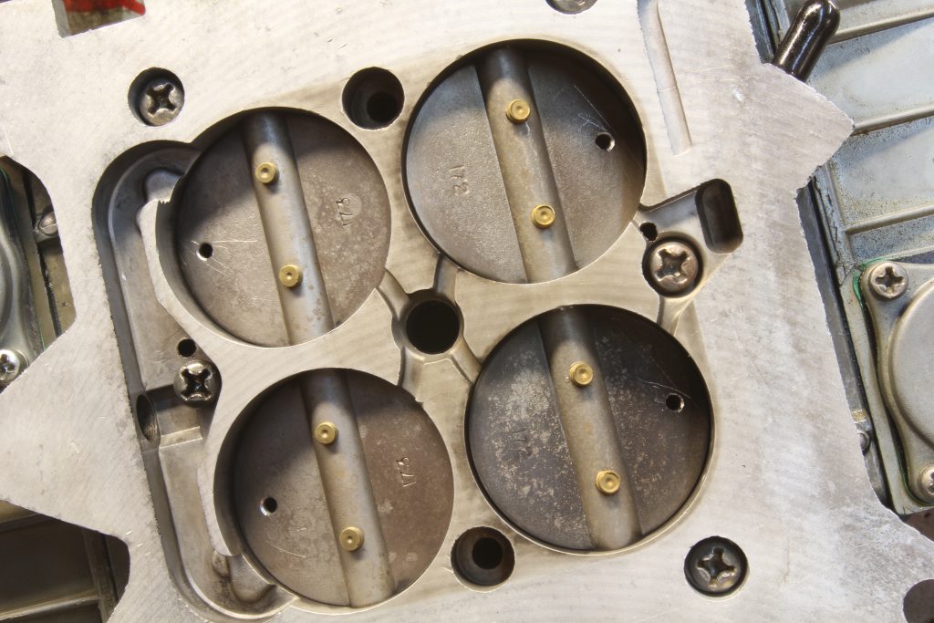 close up of throttle plates on a holley four barrel carburetor