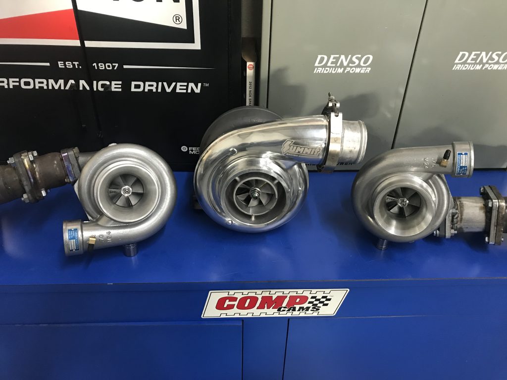 a trio of turbochargers on a display table