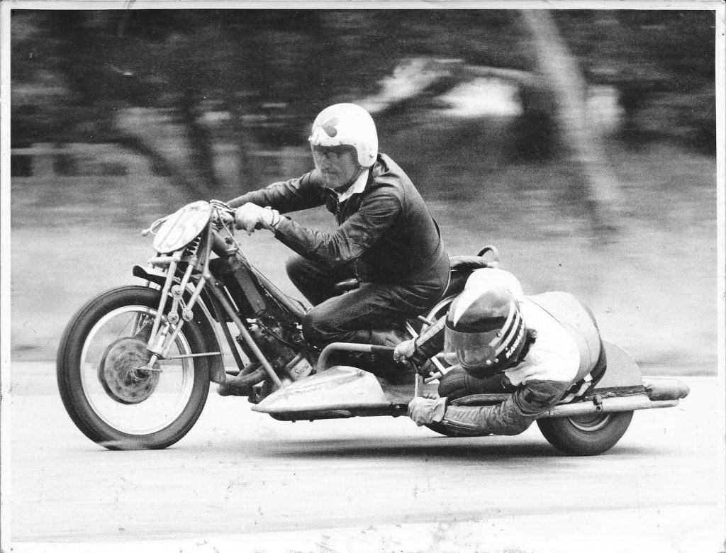 vintage photo f a sidecar motorcycle racer and passenger