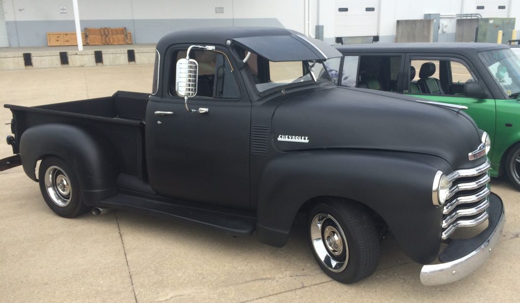 black chevy 3100 pickup truck at car show