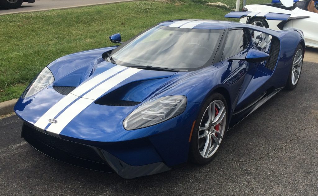 blue ford gt parked at a car show