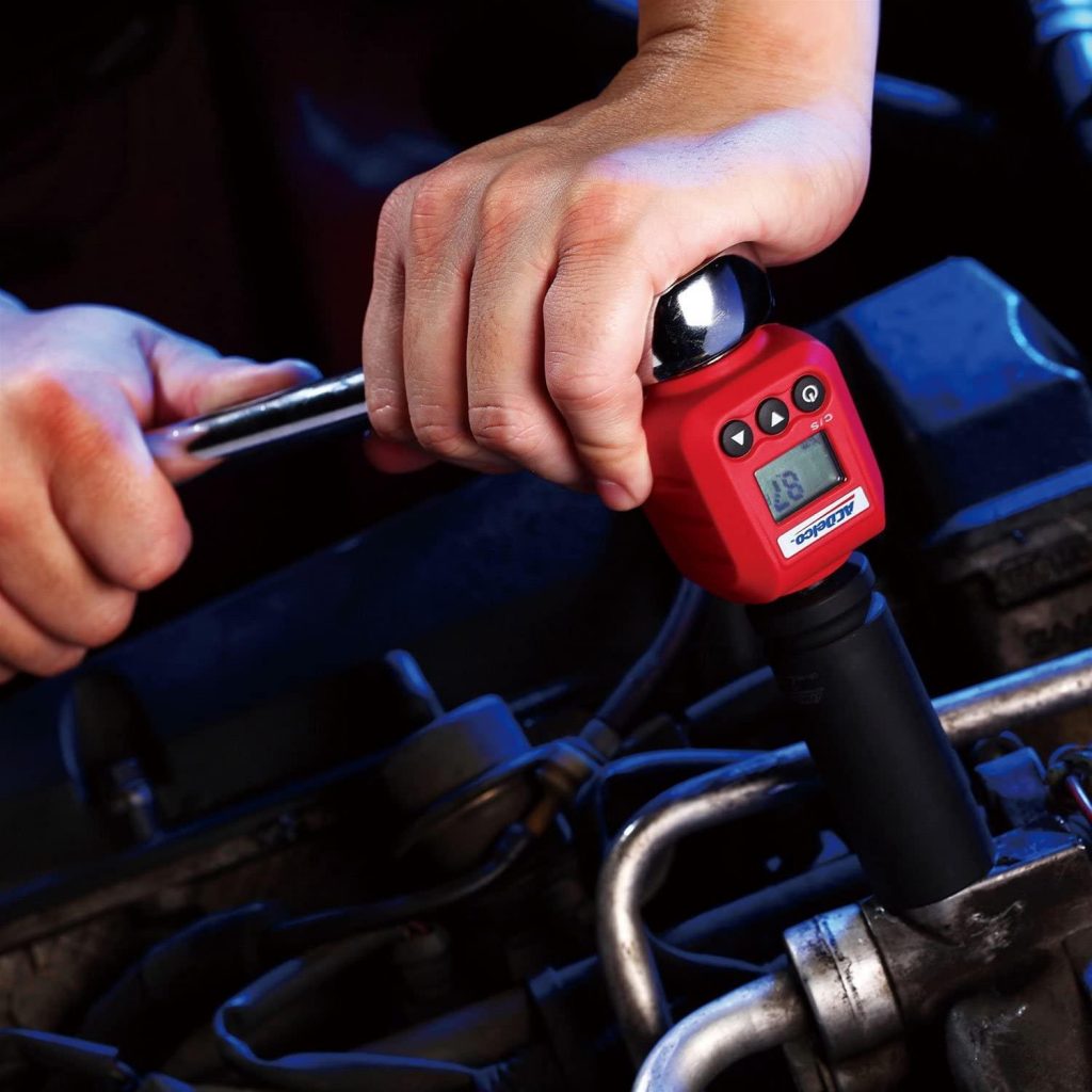 man using an ac delco torque wrench adapter