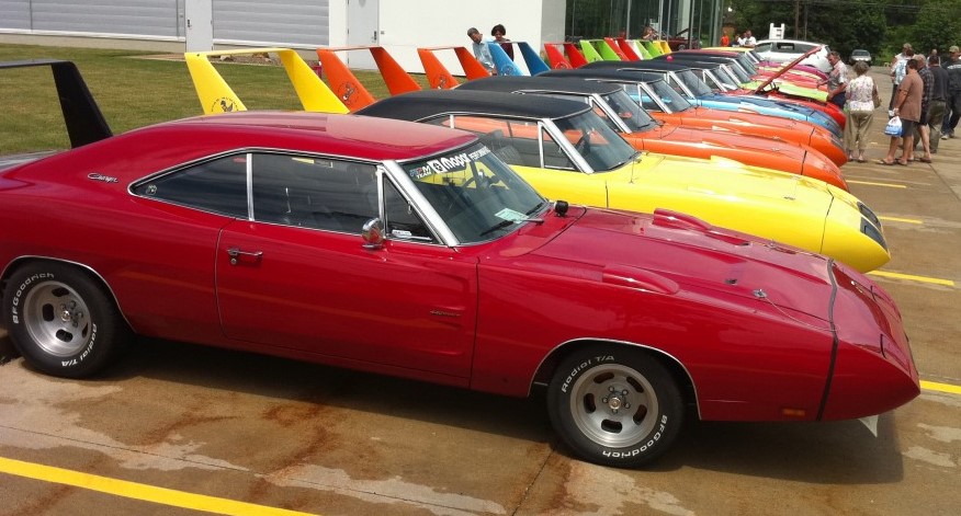 row of dodge charger daytonas and plymouth superbirds parked at summit racing near akron ohio