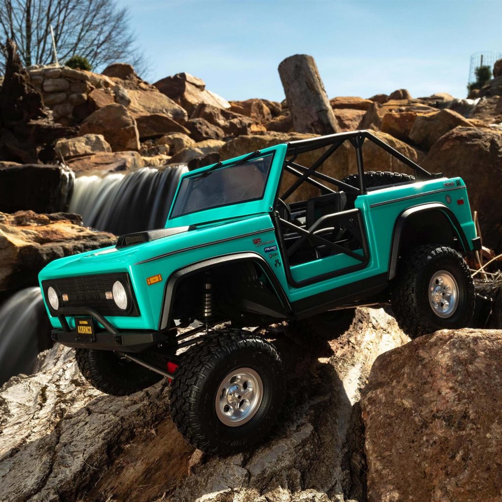 turquoise blue ford bronco rc model toy rc truck made by axial crossing rocks