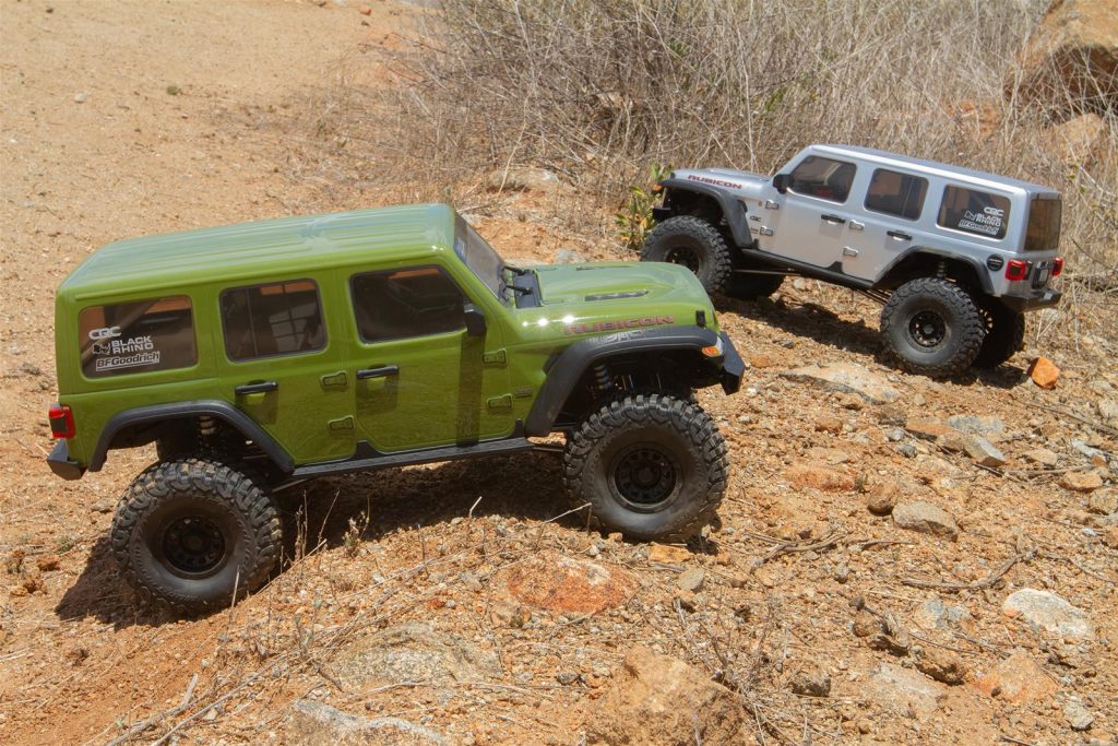paria of axial jeep wrangler toy model rc cars on dirt hill