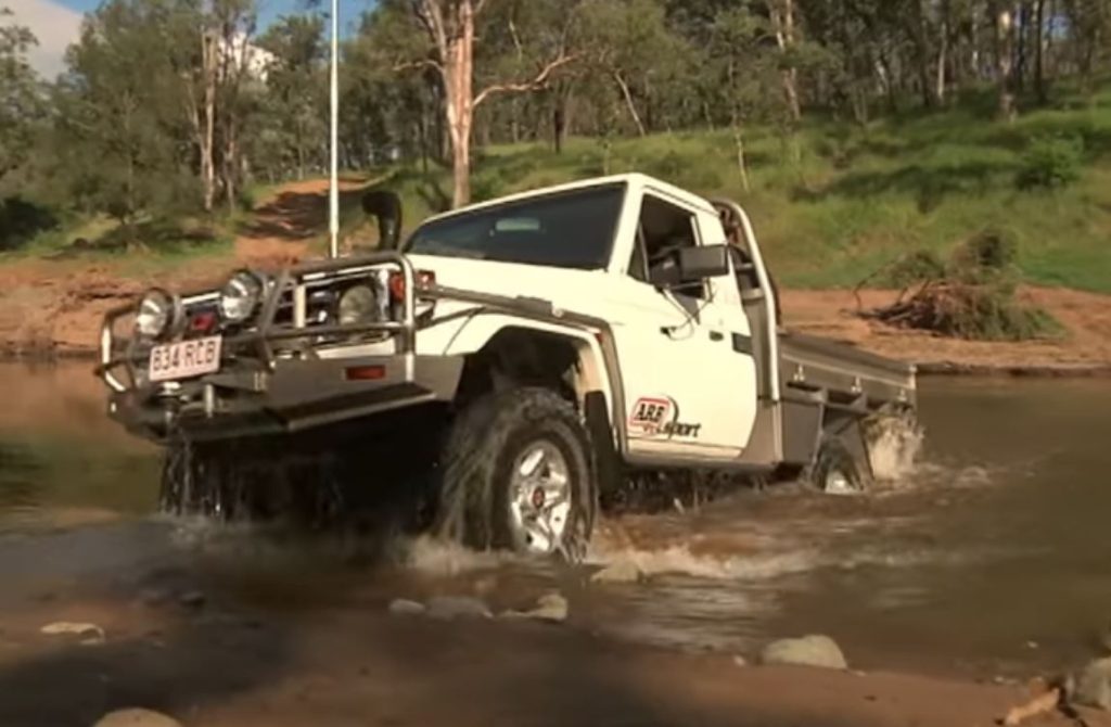 water fording crossing in arb flatbed off road rig