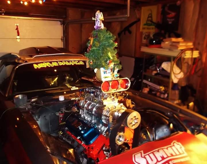 supercharged race drag car with Christmas tree atop its blower