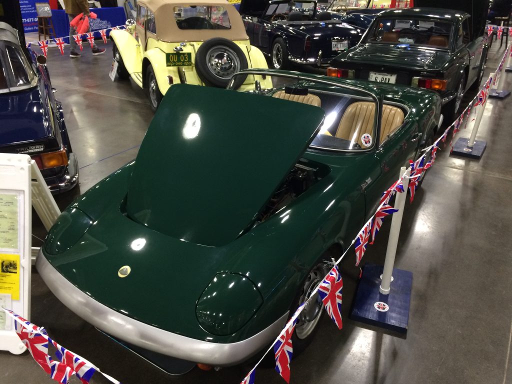 green 1963 lotus elan british sports car at indoor car show