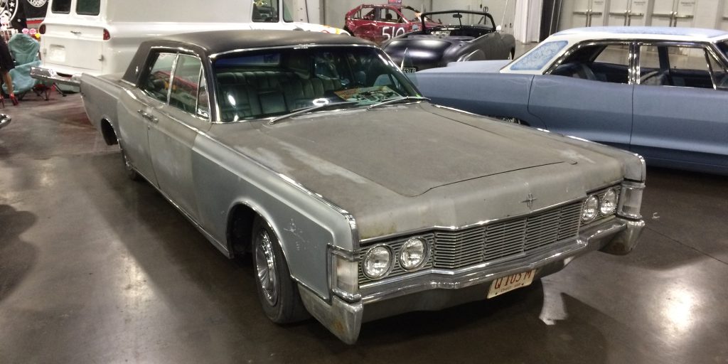 1969 lincoln continental with suicide doors at indoor car show